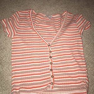 pink short sleeve v neck shirt